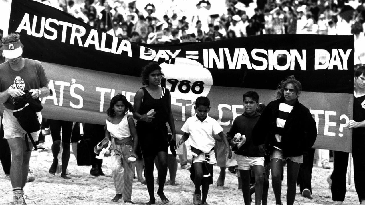 Protesters at Frenchmans Bay, La Perouse for the First Fleet re-enactment carry banners "Australia Day = Invasion Day" in 1988. Picture: Michael Jones